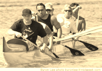Adaptive paddlers entering the outrigger canoe.